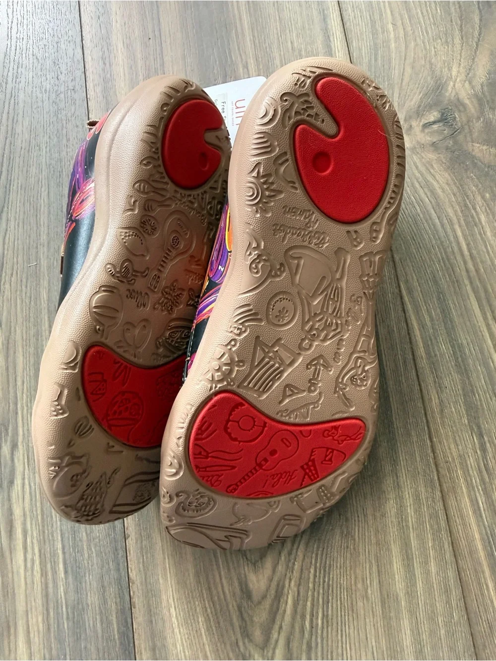 UIN Black Slip-On Shoes with Orange and Purple Swirl